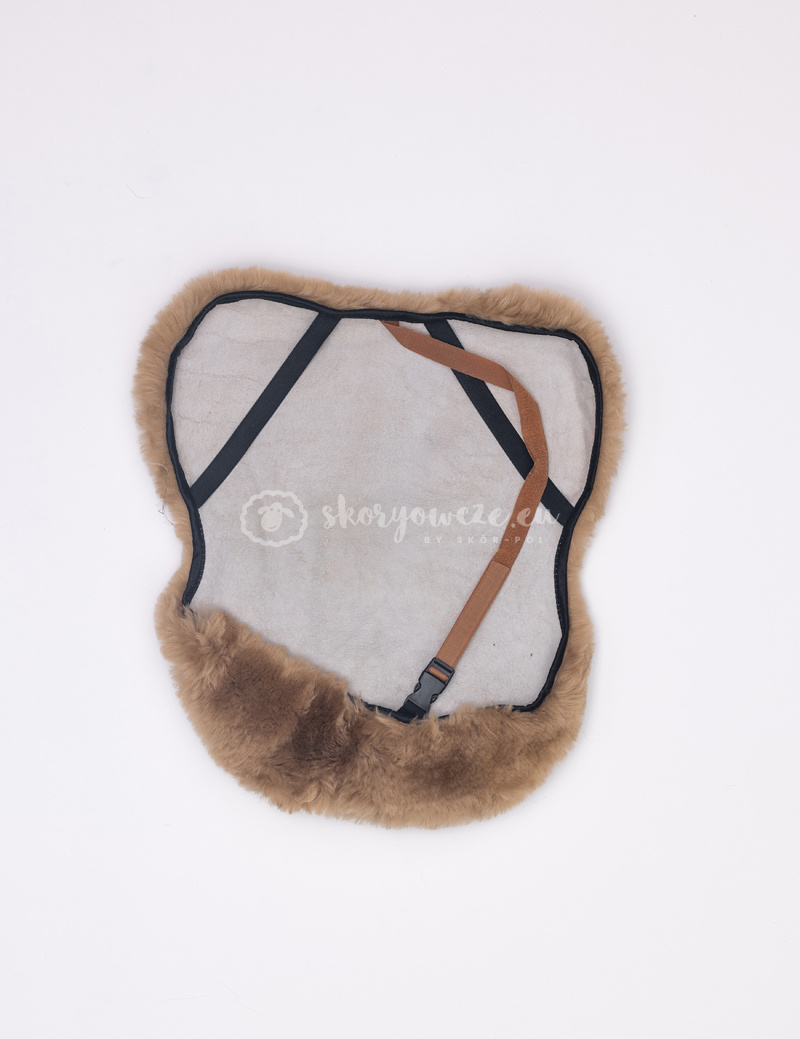 A cover for a horse saddle made of natural sheepskin A cover for a horse saddle made of natural sheepskin
